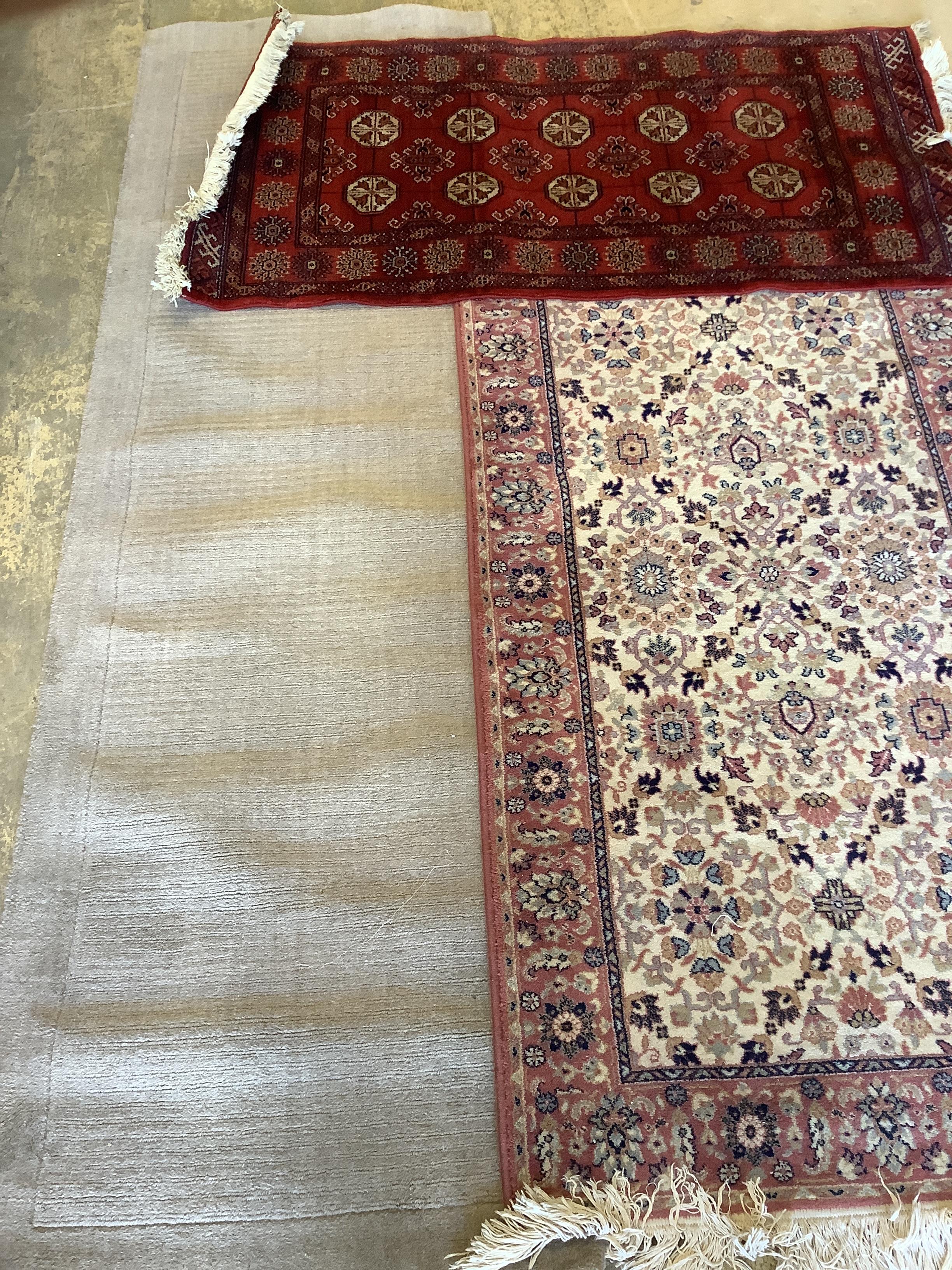 A machined Bokhara style rug, 140 x 72cm together with a North West Persian style rug and a contemporary runner